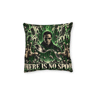 Cushion artwork: A dark-coated figure in sunglasses holds his hands around a floating, curved spoon, surrounded by green code and impossible architectural patterns.
