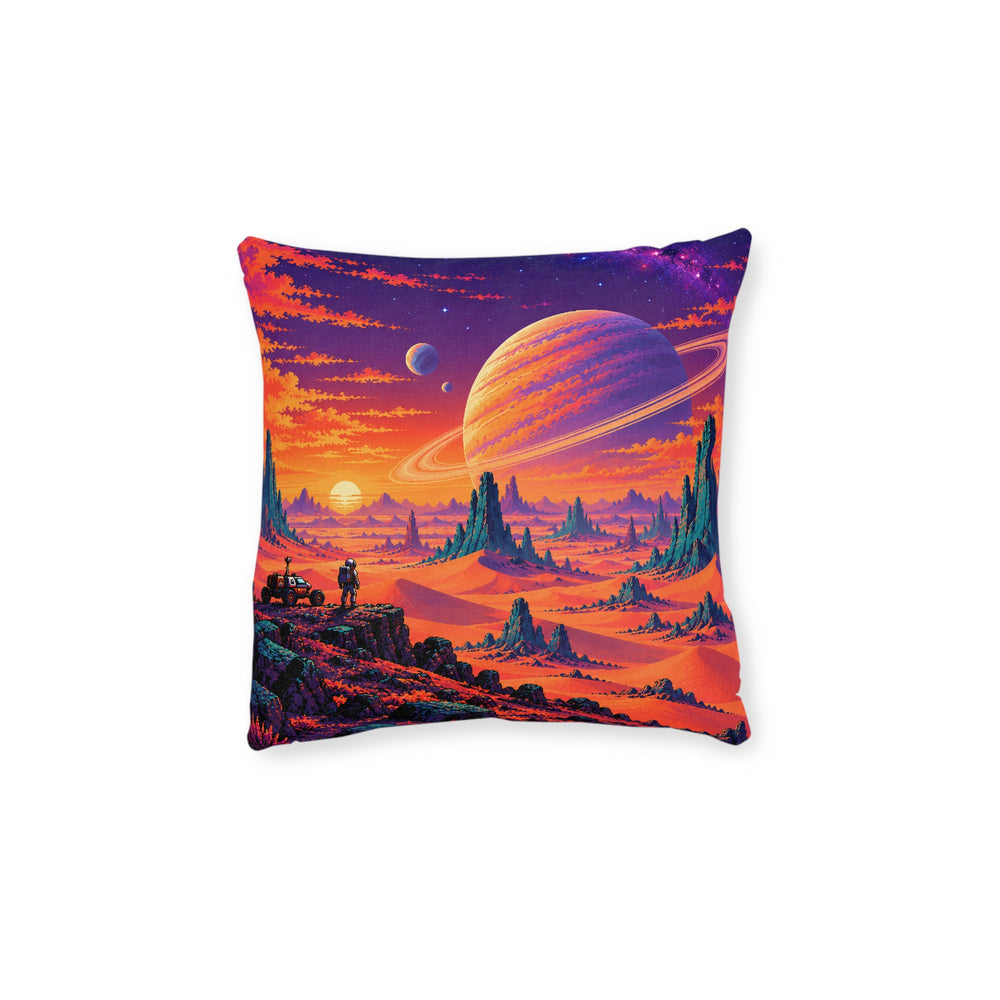 Cushion artwork: A vast ringed planet hangs over an orange alien desert, with sharp rock towers and a tiny traveller giving the scene a sense of scale.