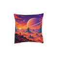 Cushion artwork: A vast ringed planet hangs over an orange alien desert, with sharp rock towers and a tiny traveller giving the scene a sense of scale.