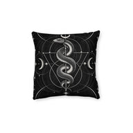 Cushion artwork: A detailed serpent coils around a slender vertical axis beneath a crescent moon, its head raised above the looping body.