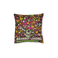 Cushion artwork: A grinning skull with spiral eyes is engulfed by bright symbols, cartoon fragments and cursor arrows above a 'Brainrot Loading' progress bar.