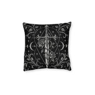 Cushion artwork: An ornate dagger with a skull pommel stands between curling rose stems, its long blade surrounded by crescent moons and fine geometric circles.