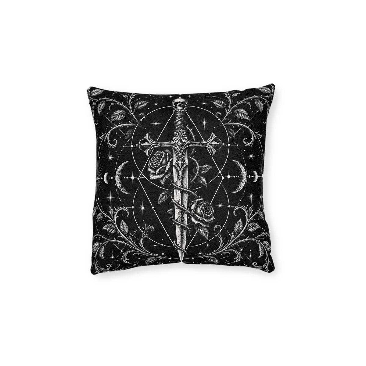 Cushion artwork: An ornate dagger with a skull pommel stands between curling rose stems, its long blade surrounded by crescent moons and fine geometric circles.