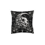 Cushion artwork: A feline skull nestles among curling leaves and berries beneath a broad crescent moon, with fine circles and triangular lines framing the composition.
