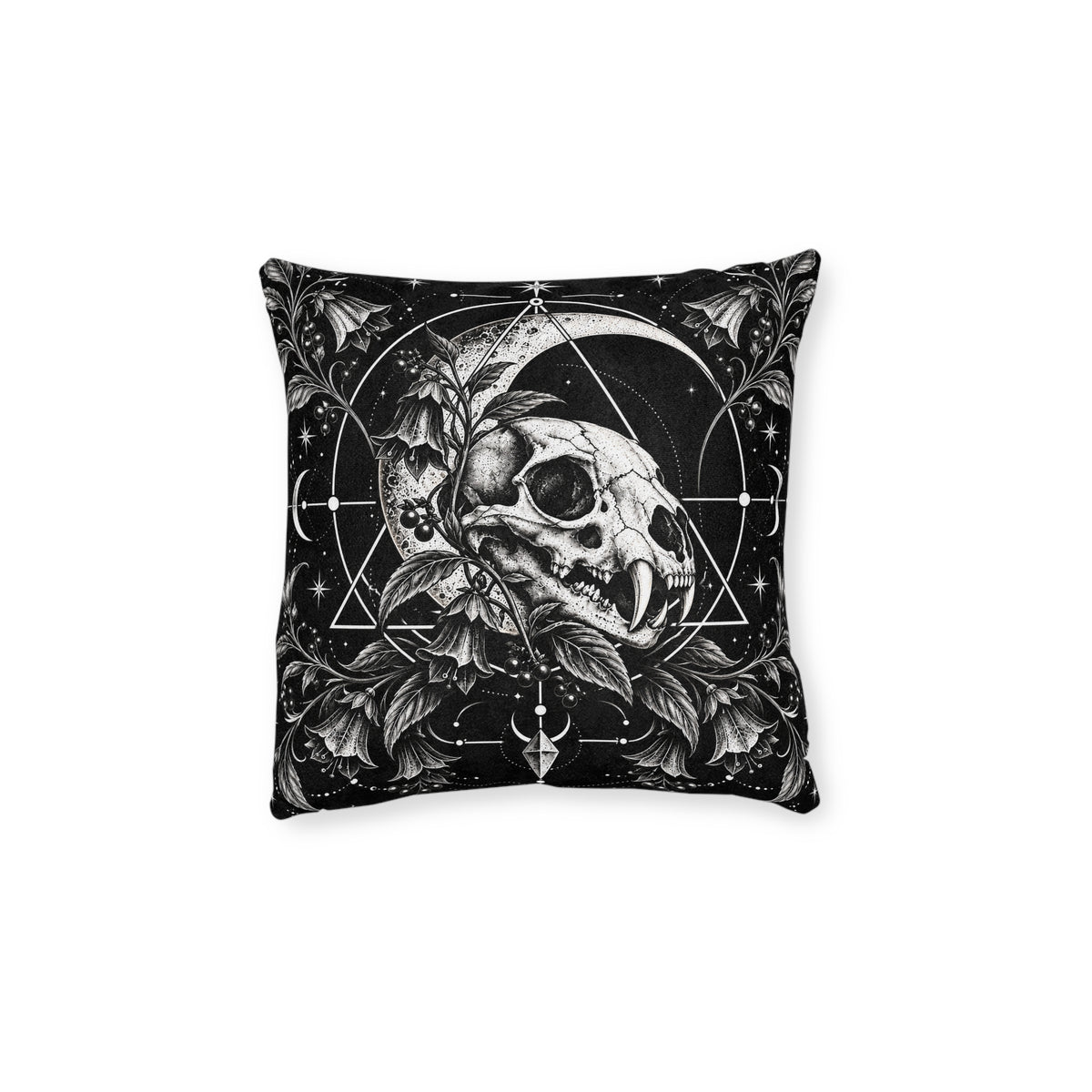Cushion artwork: A feline skull nestles among curling leaves and berries beneath a broad crescent moon, with fine circles and triangular lines framing the composition.
