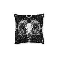 Cushion artwork: A ram skull faces forward with deeply curled horns, surrounded by intersecting circles, triangles and starbursts.